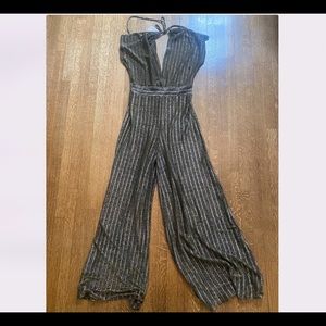 Gold sparkle jumpsuit with deep V neck